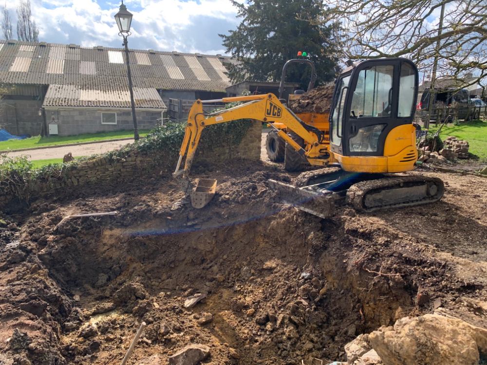 Digger creating pond